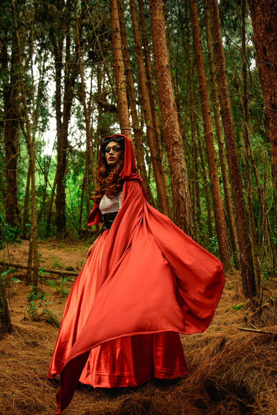 woman in red dress on forest