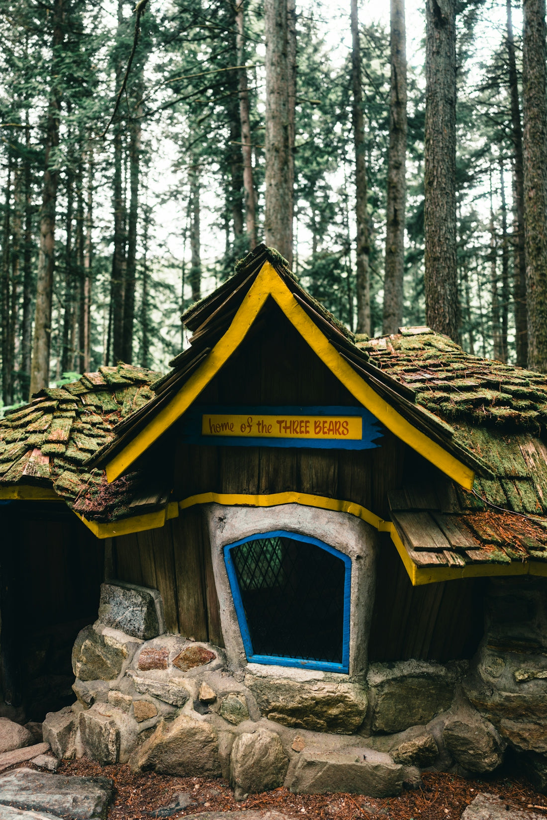 The house of the three bears is nestled in the forest.